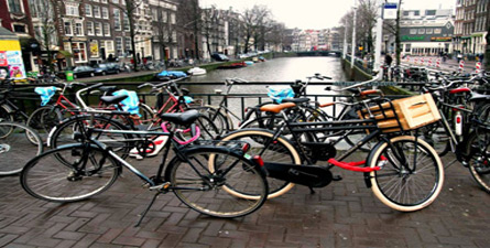 Hop on a bicycle and venture across the canals and narrow cobblestone streets of Amsterdam!